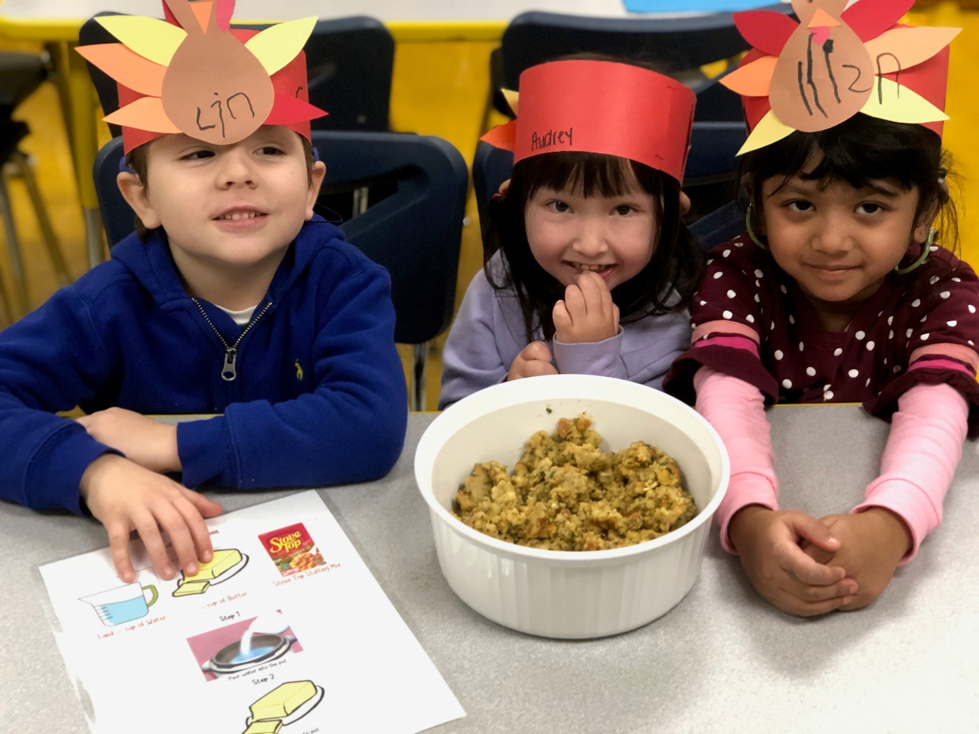 Three young children making stuffing for Thanksgiving