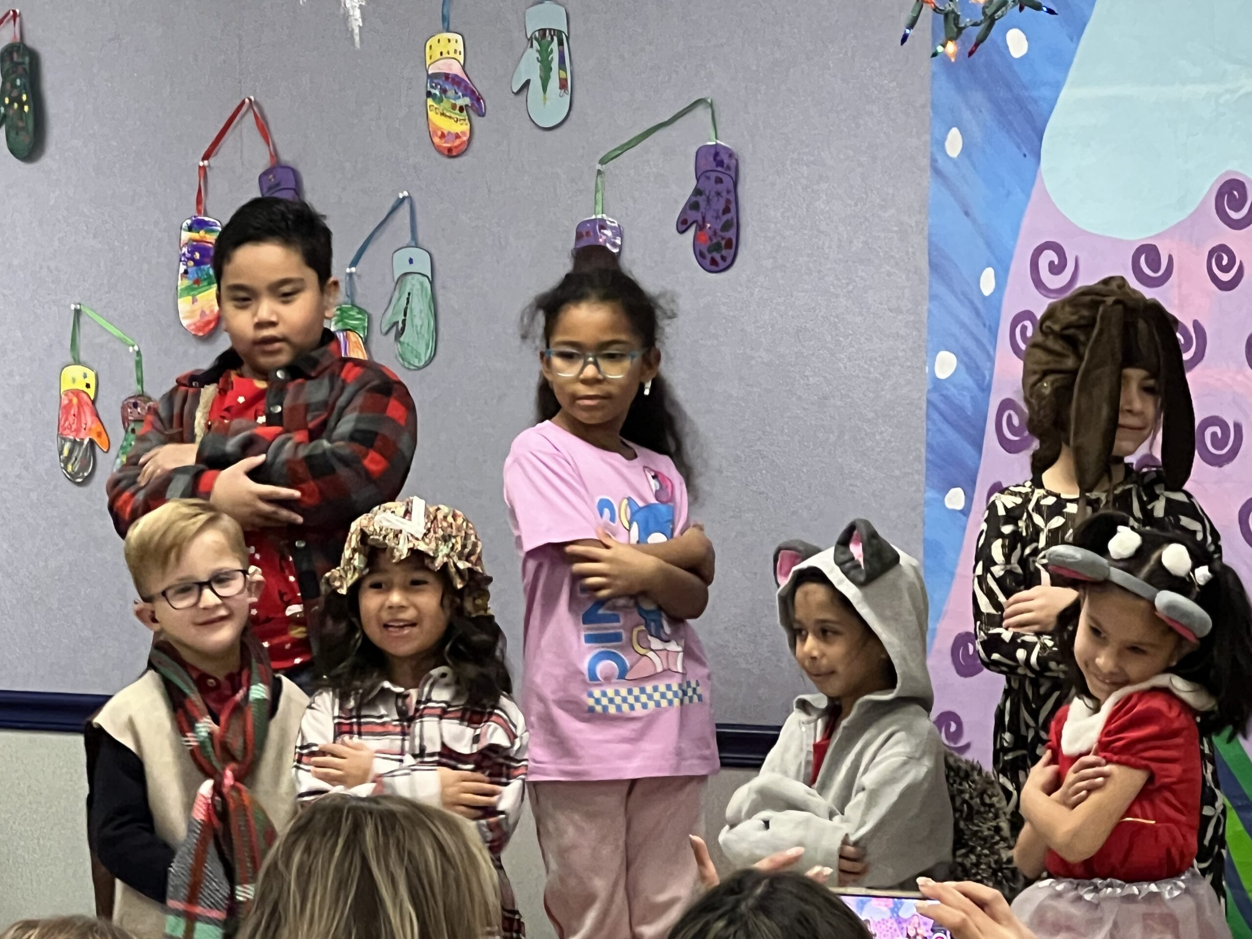 Children dressed in holiday costumes performing a song