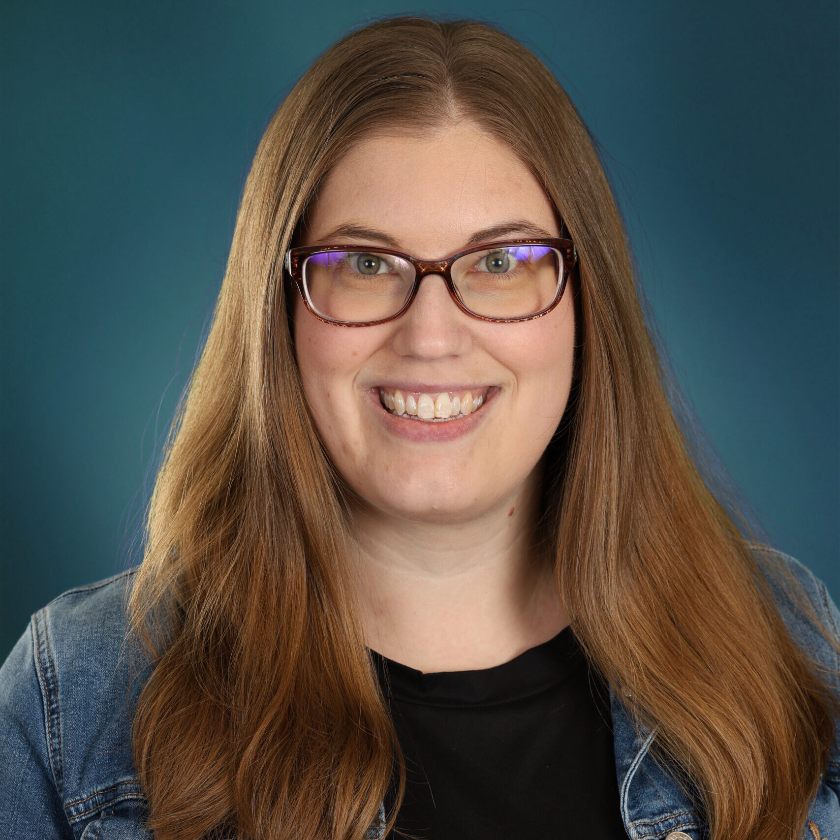 Annie Gilmartin, woman with long brunette hair and glasses